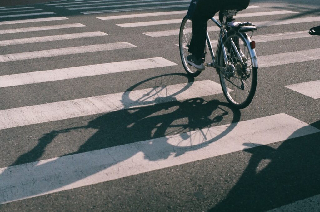 a person riding a bicycle on a street